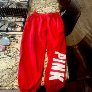 Red sweatpants from PINK in a size small.